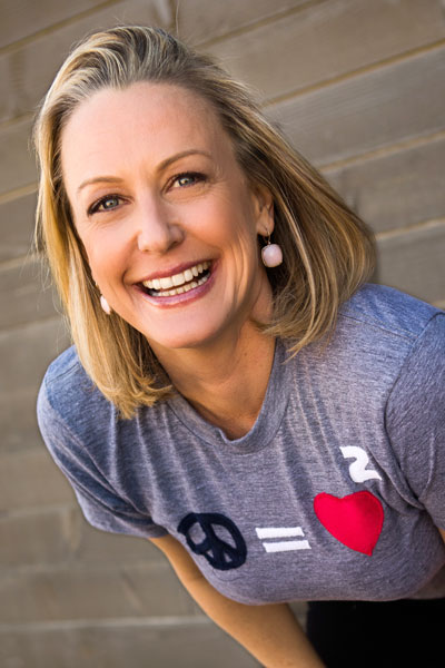 Elizabeth Winkler Smiling and leaning into the frame