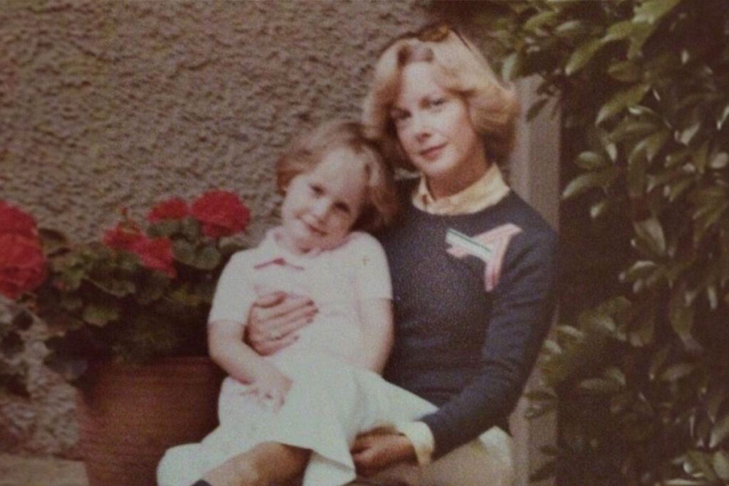 Elizabeth WInkler sitting the lap of her mother as an adolescent